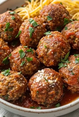 Delicious baked Italian meatballs served with marinara sauce.