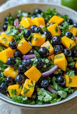 Fresh blueberry mango salad twist with vibrant fruits and greens