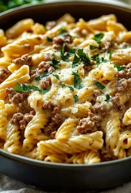 Creamy high protein beef pasta garnished with parsley in a bowl