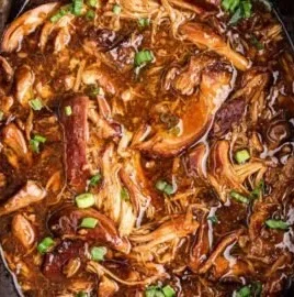 Crock Pot Bourbon Chicken dish with tender chicken in a savory sauce