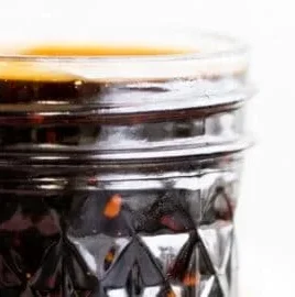 Homemade teriyaki sauce in a glass jar