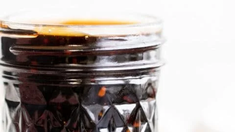 Homemade teriyaki sauce in a glass jar