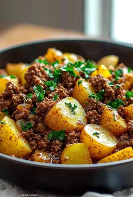 One-pan Ground Beef and Potatoes dinner served hot on a plate.