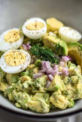 Herby avocado egg salad served in a bowl, ready to enjoy for a quick lunch.