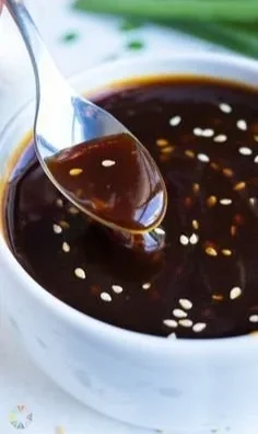 Bowl of homemade teriyaki sauce with ingredients in the background