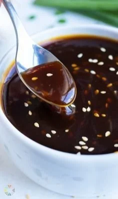 Bowl of homemade teriyaki sauce with ingredients in the background