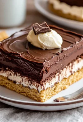 Delicious no-bake chocolate eclair cake with chocolate frosting and cream filling