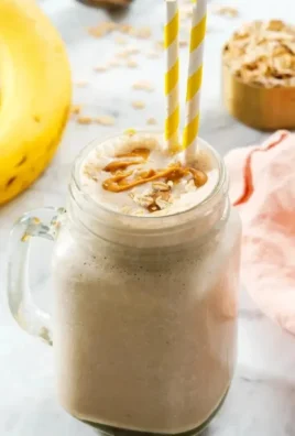 Delicious peanut butter smoothie with banana and spinach in a glass