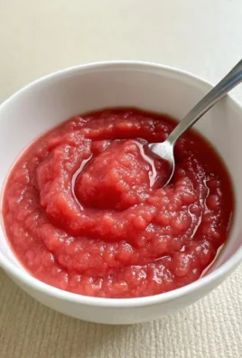 Delicious homemade rhubarb sauce in a bowl, perfect for spring recipes
