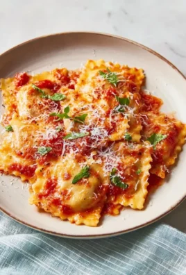 Delicious slow cooker lasagna prepared with layers of pasta, cheese, and sauce.