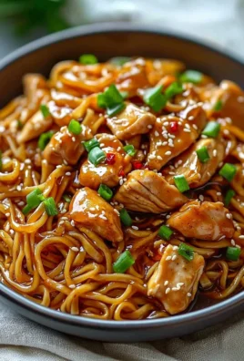 Delicious Sticky Garlic Chicken Noodles with savory sauce, ready to enjoy.
