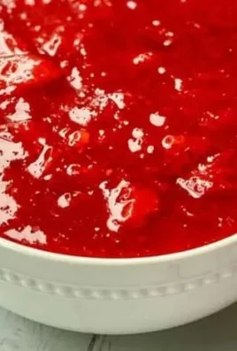 Freshly baked strawberry rhubarb pie with flaky crust and colorful filling