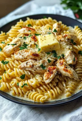 Delicious creamy garlic parmesan chicken pasta topped with herbs and cheese