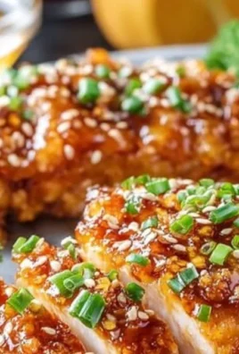 Baked Crunchy Hot Honey Chicken served with garnish on a plate
