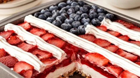 Delicious Strawberry Pretzel Jello Salad served in a bowl with fresh strawberries.