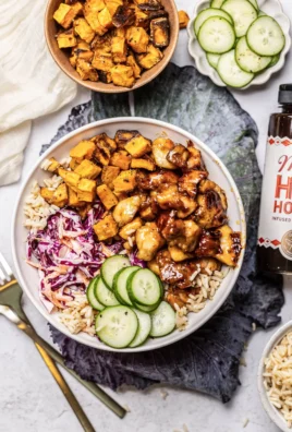 Hot honey chicken bowl with colorful vegetables and rice