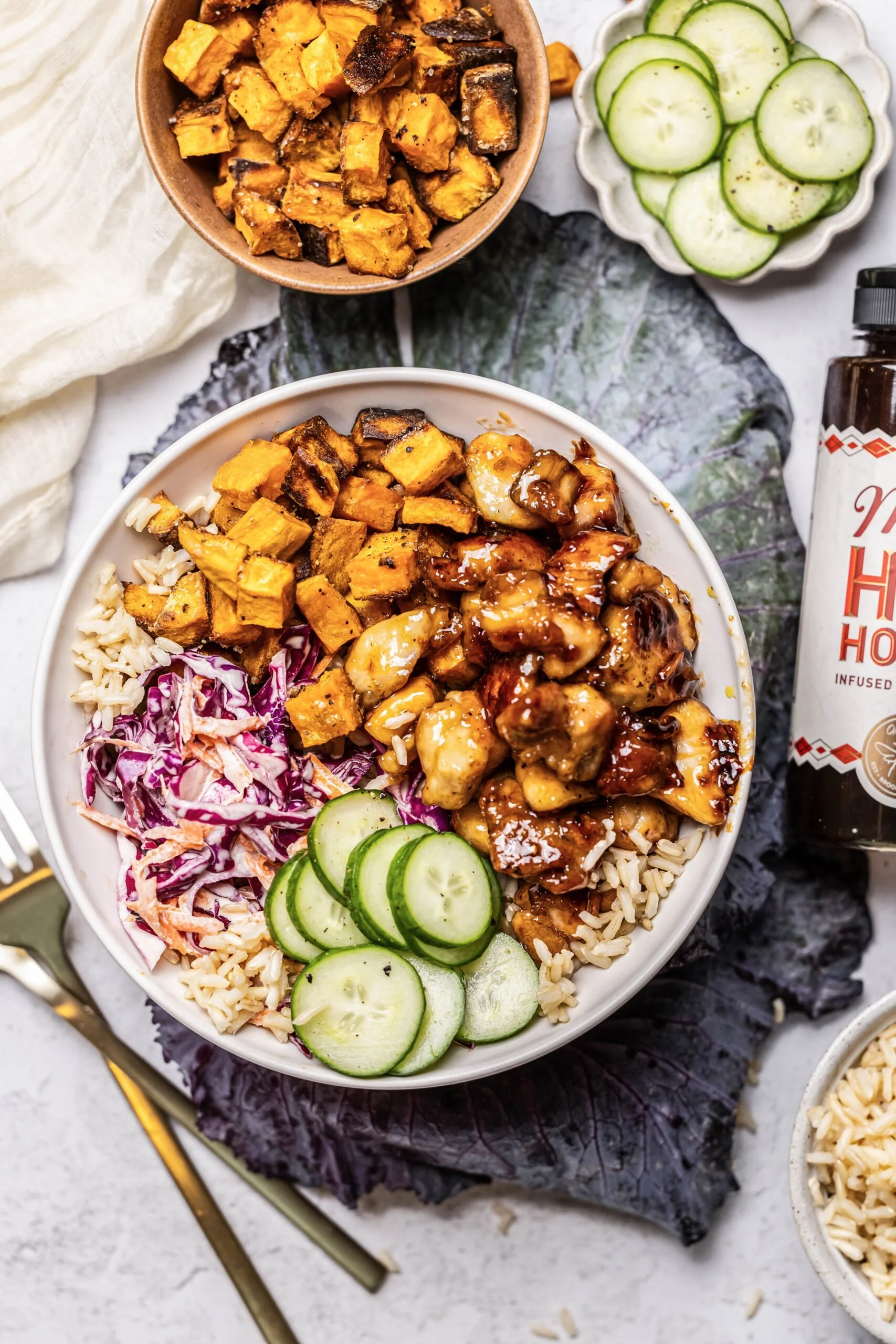Hot honey chicken bowl with colorful vegetables and rice