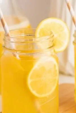 Homemade Meyer lemonade in a glass with a lemon slice