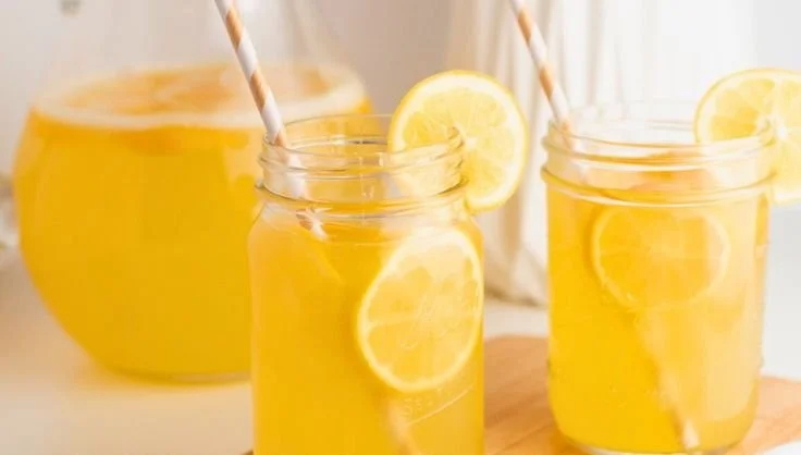 Homemade Meyer lemonade in a glass with a lemon slice