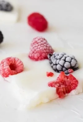 Delicious frozen yogurt bark topped with fresh fruits and nuts