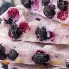 Frozen yogurt bark topped with fresh blueberries and sliced almonds
