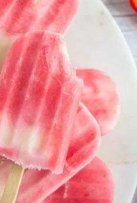 Delicious and refreshing Greek Yogurt Popsicles on a wooden stick