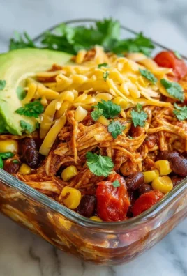 High-protein chicken enchilada bowl topped with fresh ingredients
