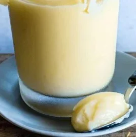 Delicious lemon cream made with lemon curd and milk served in a bowl