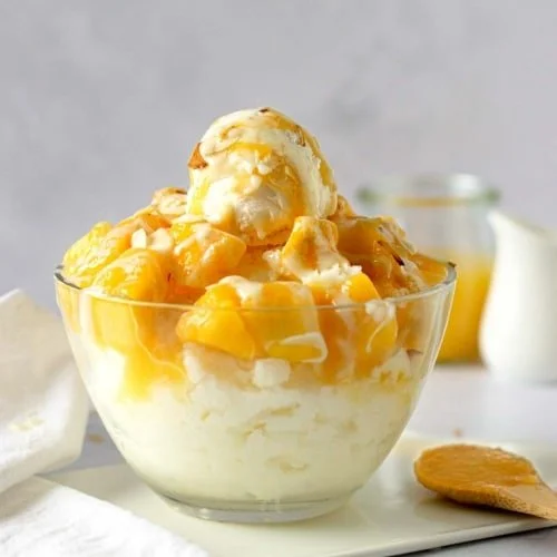 Delicious mango bingsu with shaved ice and mango slices - a refreshing Korean dessert