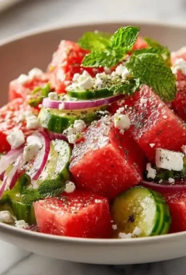Mediterranean Watermelon Salad with Feta and fresh herbs in a bowl