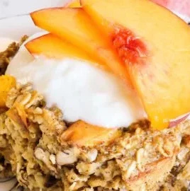Delicious Peach Baked Oatmeal topped with fresh peaches and nuts