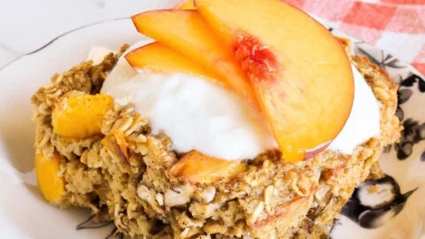 Delicious Peach Baked Oatmeal topped with fresh peaches and nuts