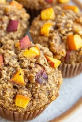 Delicious peach baked oatmeal muffins fresh out of the oven