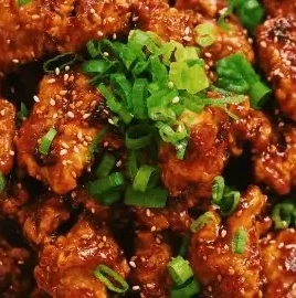 Spicy Honey Garlic Chicken served on a plate with vibrant vegetables