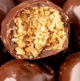 Delicious 3 ingredient peanut butter balls on a plate ready to eat