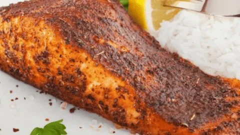 Air fryer blackened salmon served with a side of vegetables