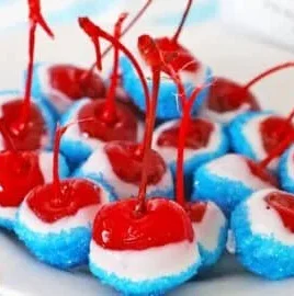 Delicious boozy cherry bombs cocktail served in glass with cherries