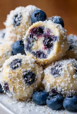 Creamy blueberry cheesecake protein balls, a healthy snack option.