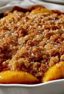 Delicious easy fresh peach cobbler with cinnamon crumble topping served warm