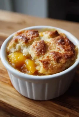 Easy peach cobbler made with canned peaches served in a dish