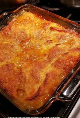 Bowl of homemade easy peach cobbler with fresh peaches and a golden crust