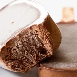 Delicious homemade healthy fudgesicles served on a wooden table