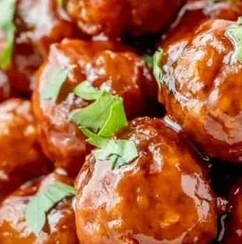 Honey BBQ crockpot meatballs served on a plate