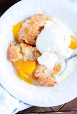 Delicious peach cobbler dessert made following Paula Deen's quick recipe