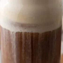 Homemade Starbucks brown sugar cold foam atop a coffee drink