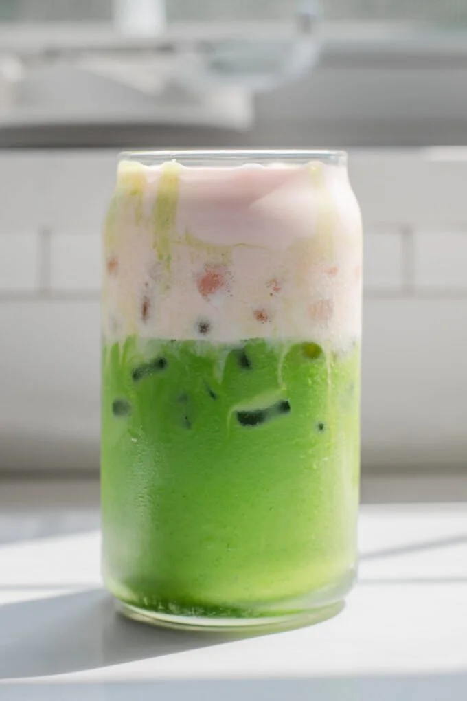 Starbucks Iced Matcha Latte with Strawberry Cold Foam in a glass