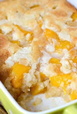 Delicious super easy peach cobbler dessert served warm with ice cream