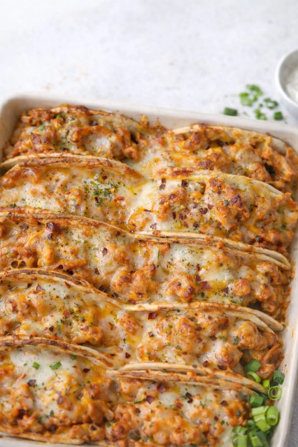 Delicious baked chicken bacon ranch tacos served on a plate with toppings