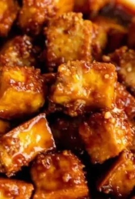 Baked Gochujang tofu served with vegetables on a plate