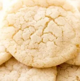 Chewy sugar cookies on a cooling rack, golden brown and appetizing.